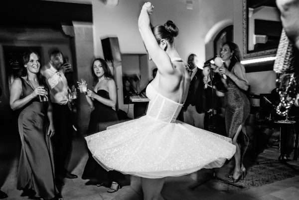 Wedding band hire, reception Party Bride dancing in front of the band